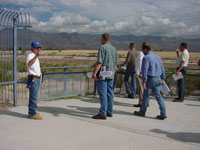 Photo of an on-site Pre-Bid Meeting was conducted on October 10, 2009 and attended by Pima County Regional Flood Control District and Procurement Staff and representatives from multiple contractors