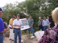 Photo of an on-site Pre-Bid Meeting was conducted on October 10, 2009 and attended by Pima County Regional Flood Control District and Procurement Staff and representatives from multiple contractors