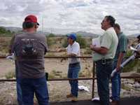 Photo of an on-site Pre-Bid Meeting was conducted on October 10, 2009 and attended by Pima County Regional Flood Control District and Procurement Staff and representatives from multiple contractors